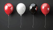 a row of balloons with a black and white one that says  black .