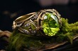 a ring with a large green gem