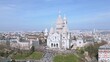 Basilica of Sacre Coeur, Montmartre hill in Paris, France. Aerial backward and sky for copy space