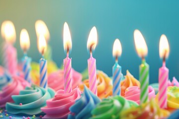 Close up shot of many lit birthday candles on a cake with colorful icing.