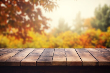 Wall Mural - Empty wooden top table with blurred autumn background.