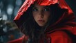 A woman in a red raincoat staring at the camera. Suitable for various concepts
