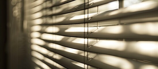 Poster - The sunlight filters through the window blinds, casting a beautiful pattern of tints and shades on the wooden floor