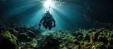 divers pass through a cave at the bottom of the deep sea