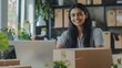 © Michael - Small business owner is working on a laptop in the warehouse