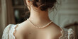 Wedding jewellery, elegant bride jewelry. Woman neck with pearl necklace, back view.