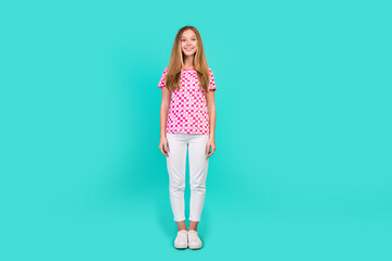 Poster - Full body photo of nice teen woman stand model cheerful smile wear trendy print pink clothes isolated on cyan color background