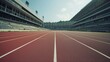 Empty athletic running tracks in a stadium filled with spectators