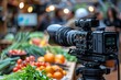 High-end professional camera records vibrant scenes at a bustling food market with colorful produce in the background