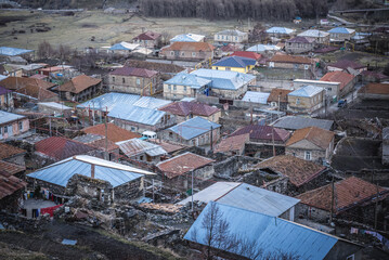 Canvas Print - Gergeti village near Stepantsminda town, formerly Kazbegi in Mtskheta-Mtianeti region, Georgia