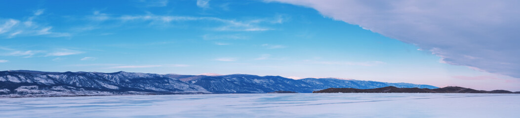 Wall Mural - Beautiful winter landscape with mountains and Lake Baikal in Siberia at sunsut. Natural background with copy space. Web banner.