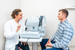 Ophthalmologist explaining the procedure of a scan to a patient