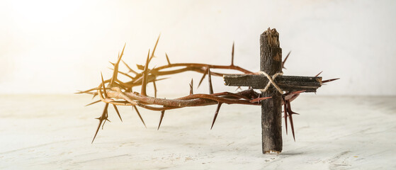 Sticker - Wooden cross with crown of thorns on light background. Good Friday concept