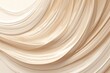 A closeup of smooth, creamy liquid foundation swirled in shades of beige and brown on an isolated background. 