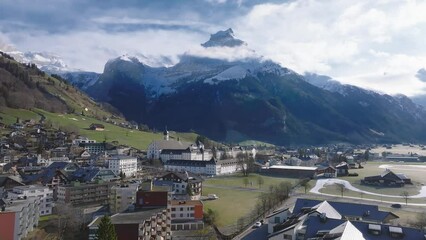 Wall Mural - Aerial panorama of the Engelberg village in Switzerland. View on the Swiss village Engelberg in the winter with snow covering the entire scenery