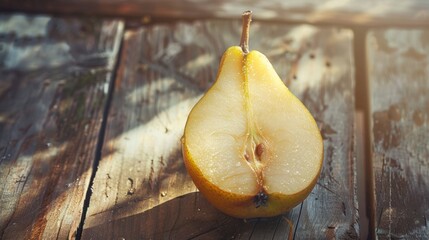 Wall Mural - Half of a ripe pear with water droplets on wooden surface