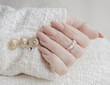 Beautiful beige manicure. Stylish nude manicure. Nail polish. Matte nails. Female hands manicure close up