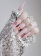 Beautiful pink manicure. Stylish pastel pink manicure with candy. Nail polish. Art nails. Candy nails.
