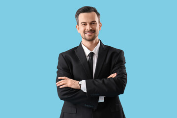 Poster - Portrait of male real estate agent on blue background