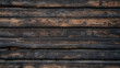 Burnished wooden logs stacked horizontally, showcasing natural textures and charred details.

