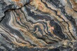 Multicolored abstract natural stone patterns with sedimentary rock layers, textured surface formation, and earthy tones for geological organic macro photography background