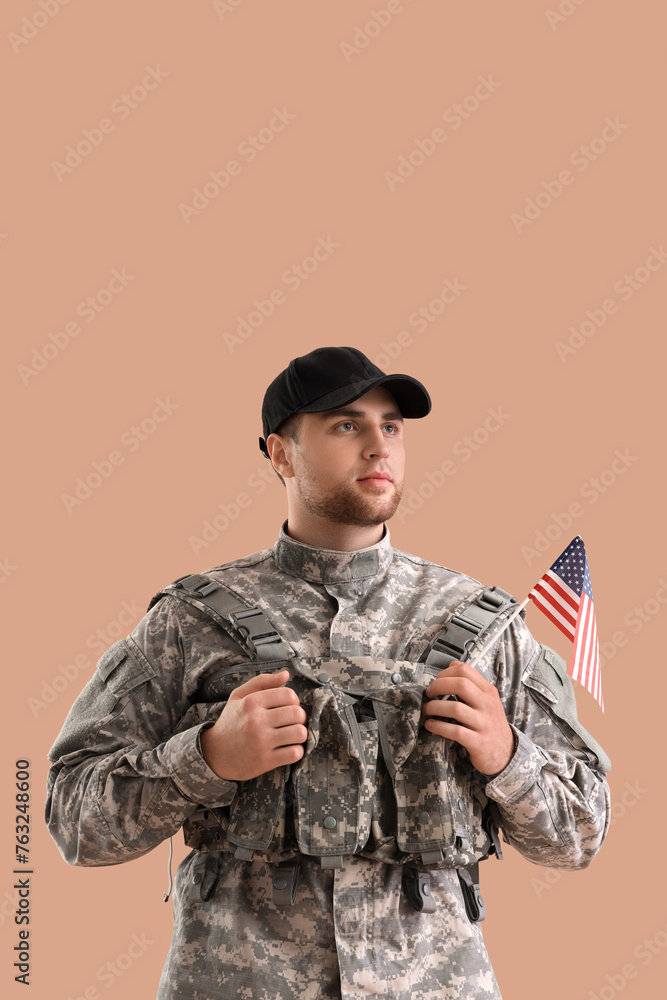 Male soldier with USA flag on brown background