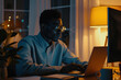 Black man, typing in home office and laptop for research in remote work, social media or blog in apartment. Freelance man at desk with computer writing email, website post and online chat in house