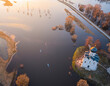 Aerial view of Nerl river flood with Church of the Intercession on the Nerl, people and SUP board, Bogolyubovskoe, Vladimir, Russia.