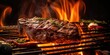 Beef steak on the grill with flames, summer BBQ