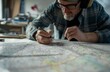 Engineer analyzing geographical map