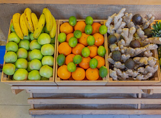 Poster - Apples Bananas Limes Grapefruit Ginger Avocado Pears Pineapples Fruits Mix in Wooden Crates