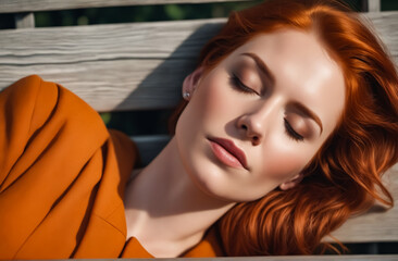 Poster - A woman with red hair is laying on a bench. She is wearing an orange jacket and has her eyes closed