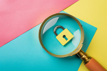 Wall Mural - A magnifier glass focuses on a padlock icon