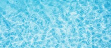 Close Up Of The Liquid Azure Water In A Swimming Pool, Creating An Electric Blue Pattern That Shimmers Like A Fluid Organism In An Aqua Font