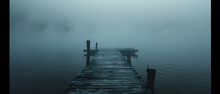 A Foggy Dock With A Pier And A Boat In The Water