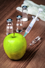 Syringe In Green Apple, Genetically Modified Fruit