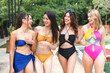 happy woman friends group in bikini having fun together in summer vacation at swimming pool, young sexy girl in swimwear relax at water outdoor holiday party, beautiful model friendship concept