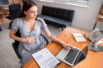 Sticker - Pregnant businesswoman working at table in office