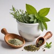 Herbs and spices in mortar and pestle on white background.