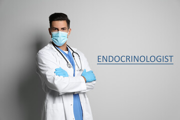 Sticker - Endocrinologist in protective mask and medical gloves on light grey background