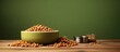 © Ilgun - Peanuts in bowl and can, pet food packaging with cat and dog nutrition on table