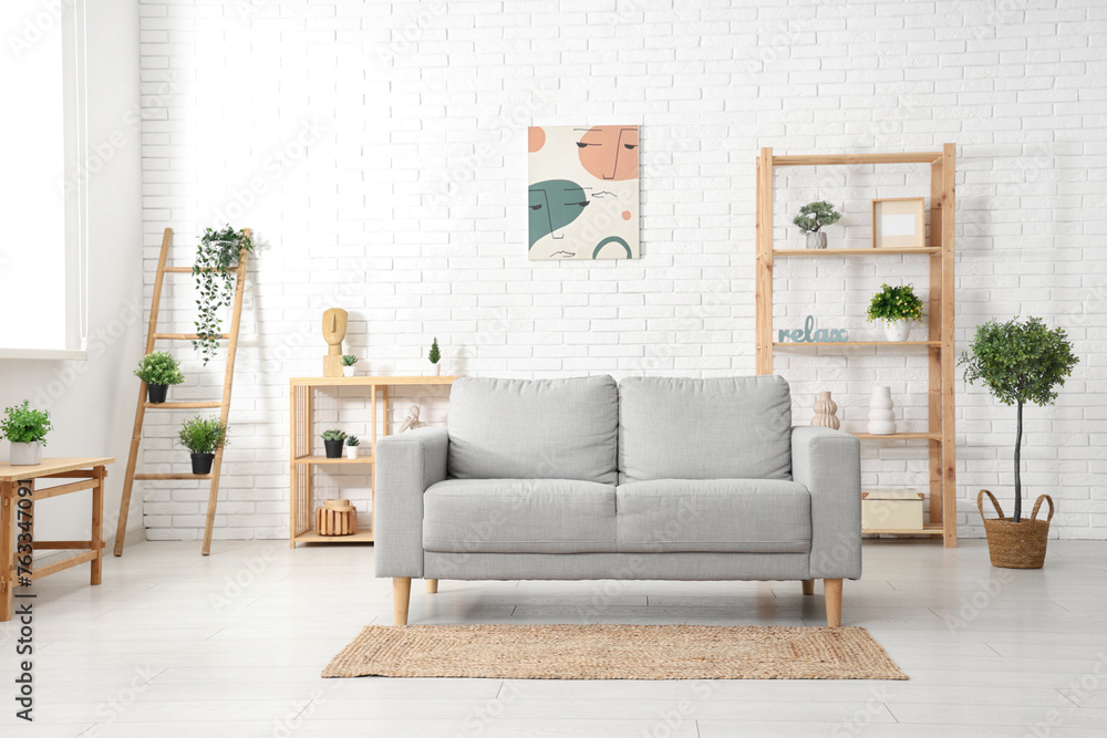 Stylish interior of modern living room with sofa