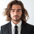 Stylish und incredible attractive man in suit and tie, long brown hair, white background