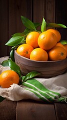 Wall Mural - a basket of oranges with leaves and a cloth with a green leaf.