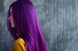 portrait of a beautiful long voluminous wavy purple hair on girl, viewed from the back,Beautiful girl with hair coloring in ultra violet. Stylish hairstyle done in a beauty salon. Fashion, cosmetics 