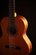 © Robert Peak - Classical Spanish flamenco guitar close up, dramatically lit isolated on black background with copy space.