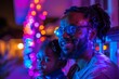 © Violetta - A father and child enjoy a colorful evening, their faces illuminated by festive lights.