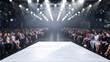 A runway with a white dress on it and a crowd of people sitting in the audience. Scene is one of anticipation and excitement as the audience waits for the model to appear on the runway