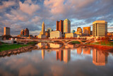 Fototapeta Paryż - Columbus, Ohio, USA. Cityscape image of Columbus , Ohio, USA downtown skyline with the reflection of the city in the Scioto River at spring sunset.