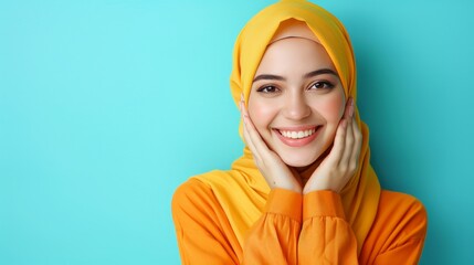 Wall Mural - Radiant asian muslim woman smiling, wishing eid mubarak on pastel background with space for text